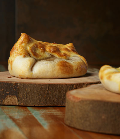 rolled dough on wooden plate