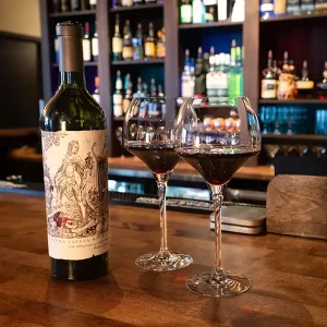 A bottle and two glasses of fine wine