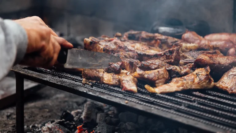 Argentinian asado made on the grill with different cuts of meat.